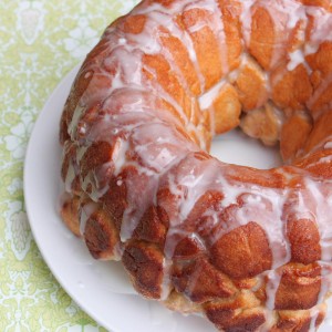 monkey bread on a plate with icing glaze