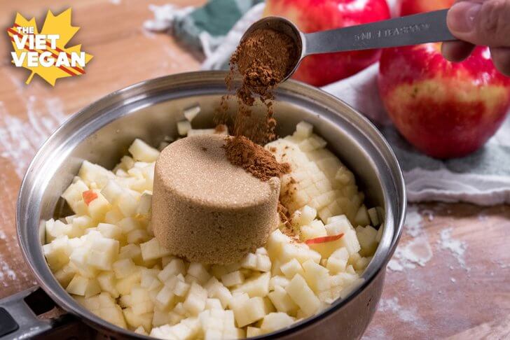 SweeTango-Apple-Hand-Pies-Adding-cinnamon-to-pot