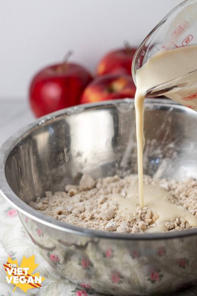 Pouring buttermilk into dry mixture