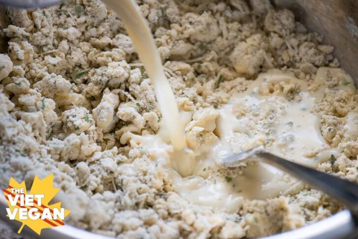 adding soy milk to the shaggy dough mixture