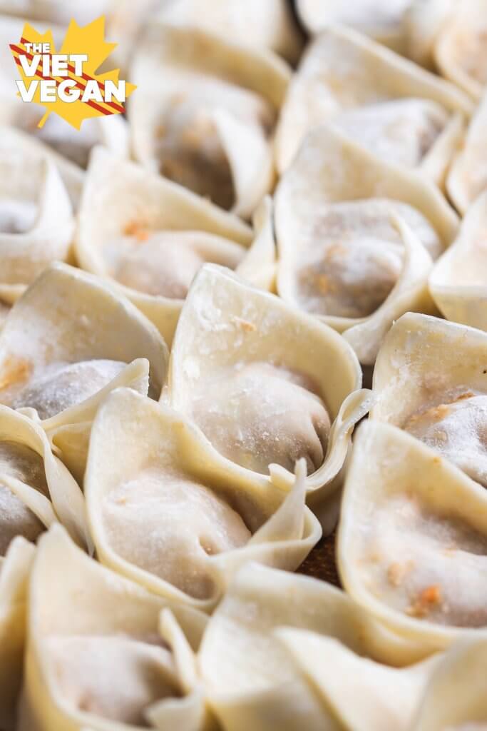 folded vegan wontons on a tray