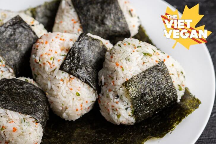 five onigiri on a sheet of nori on a plate