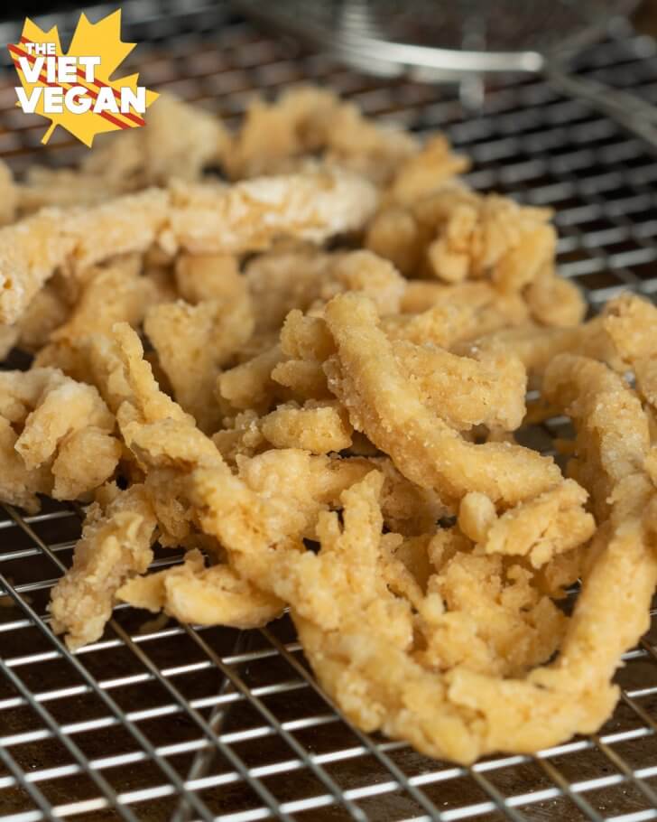 fried soy curls draining on a wire rack