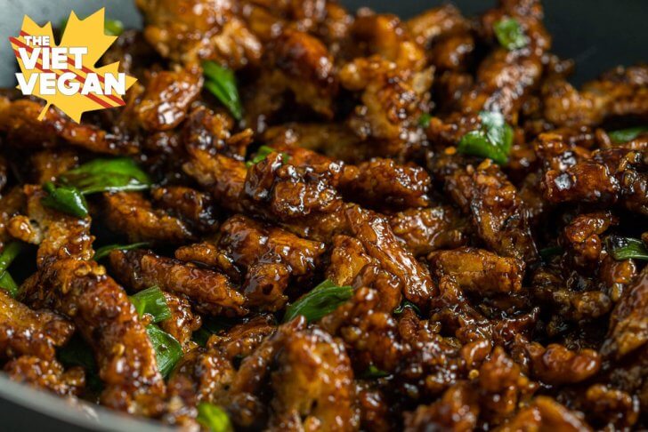 close up of soy curls cooking in a wok