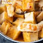 tofu, mushrooms and vegan shrimp up close in a bowl