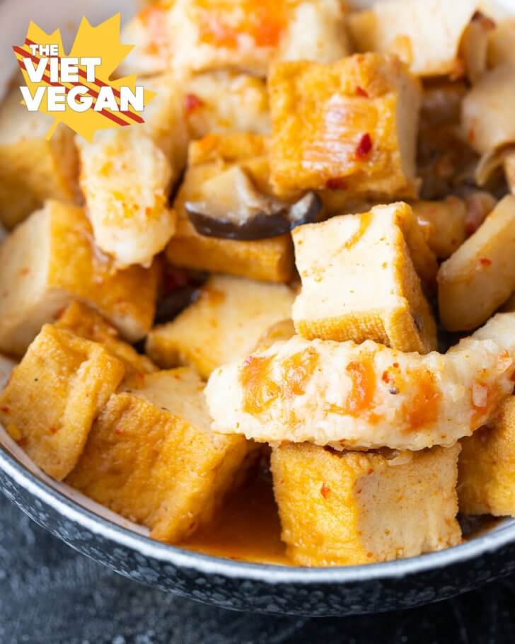 tofu, mushrooms and vegan shrimp up close in a bowl