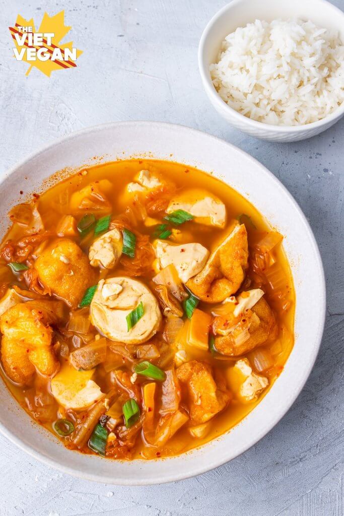 soft tofu kimchi stew in a bowl with white rice