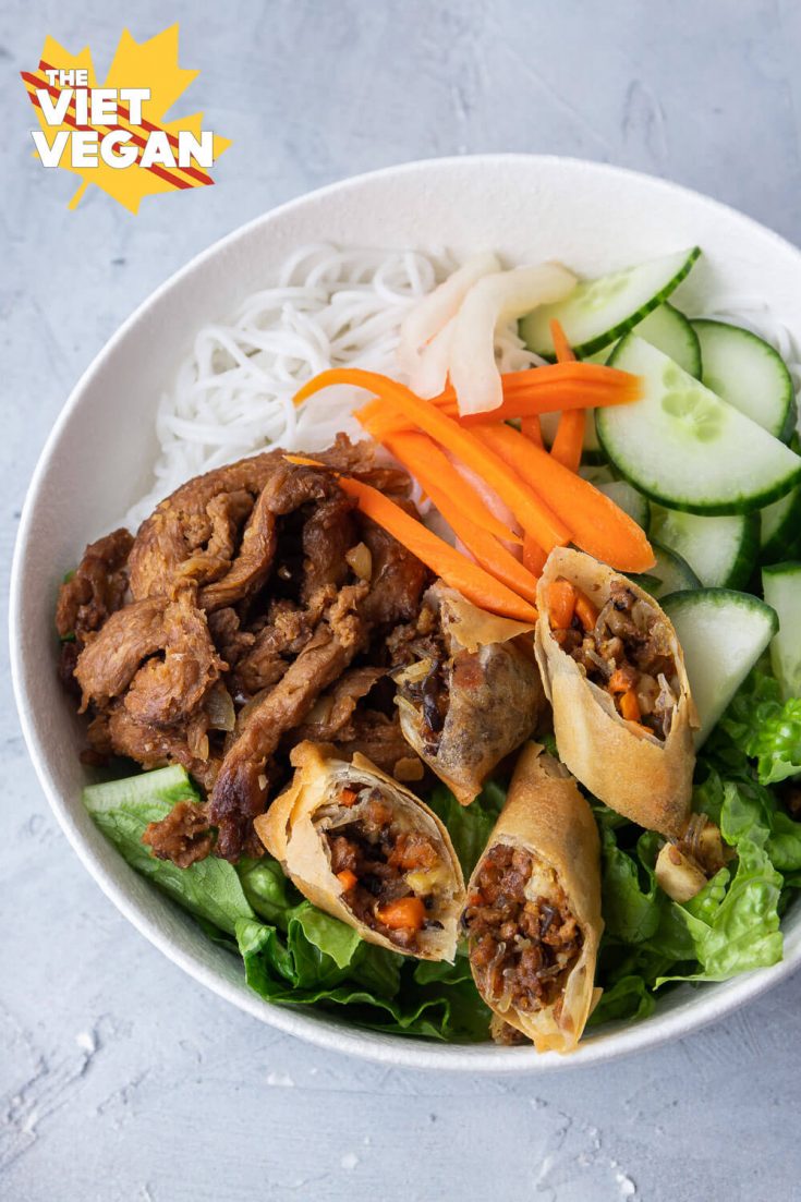 vermicelli bowl with spring rolls, noodles, pickled carrots and daikon, cucumber and lettuce