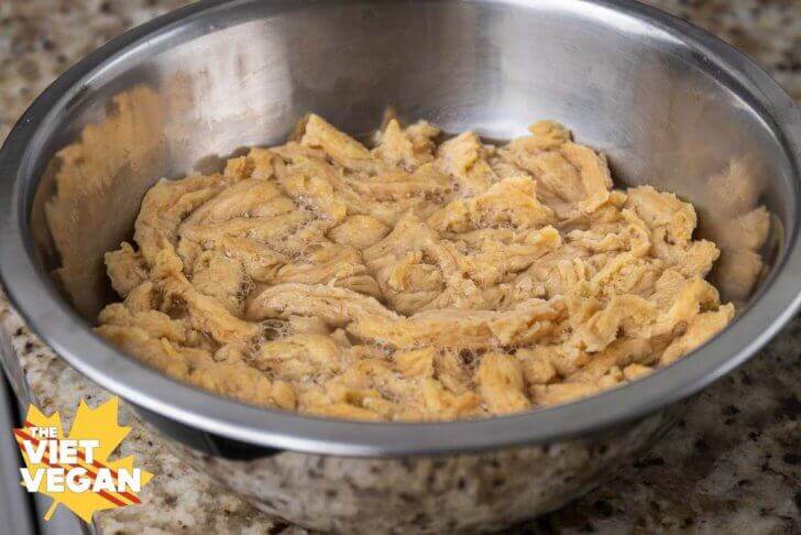 soy curls rehydrating in a large mixing bowl