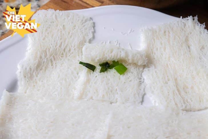 vermicelli bundles about to be rolled up with green onion oil inside