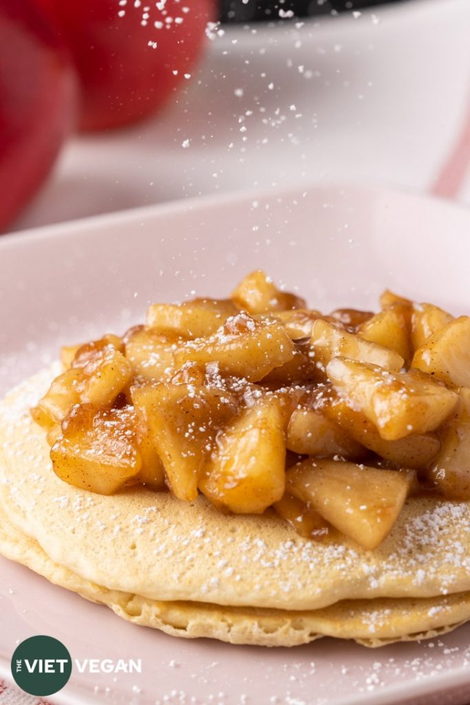 Apple pie pancakes with dusting of icing sugar