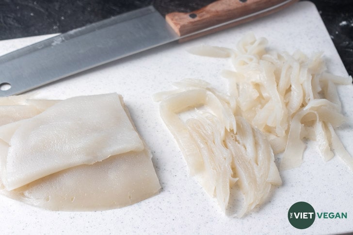 Steamed noodles being chopped