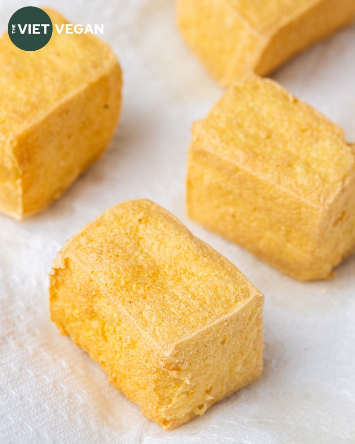 Fried tofu draining on paper towel