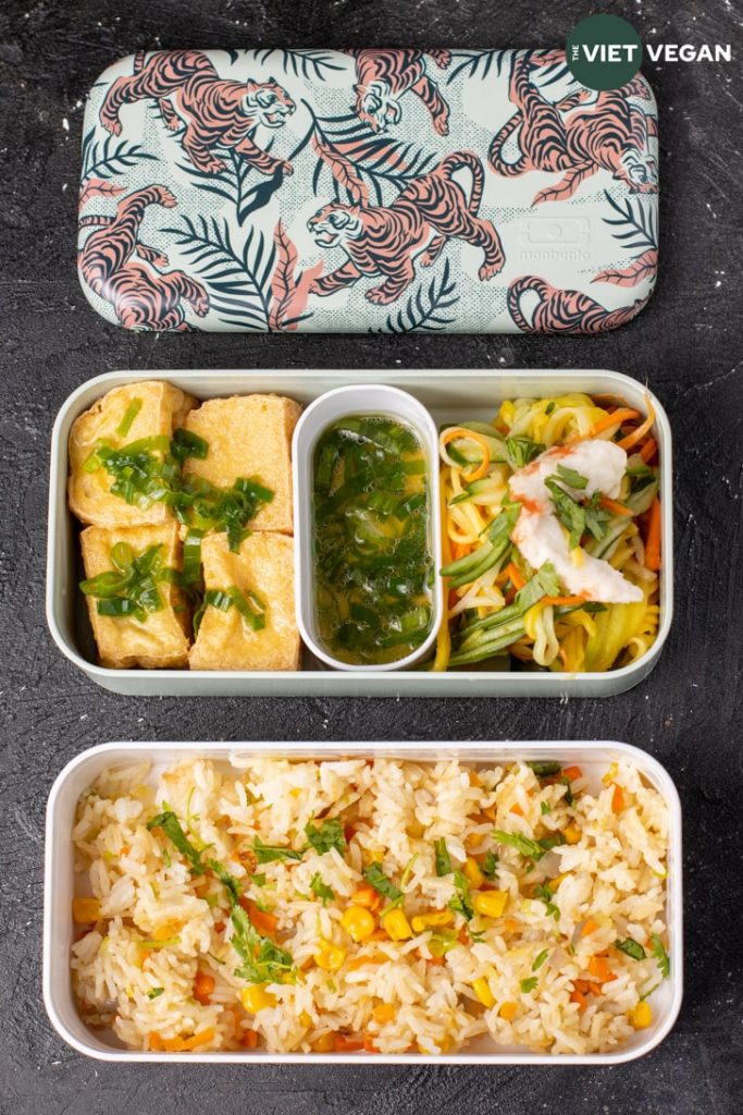 bento box with two layers, the cover has Asian-stylized tigers