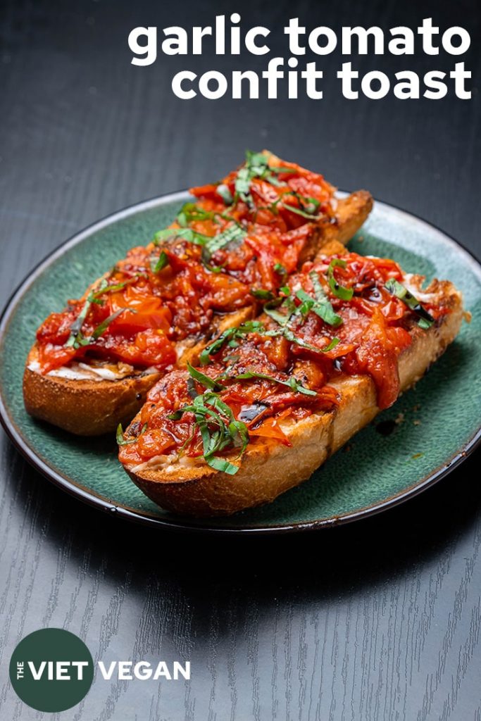 two pieces of toast with garlic tomato confit and text in the corner
