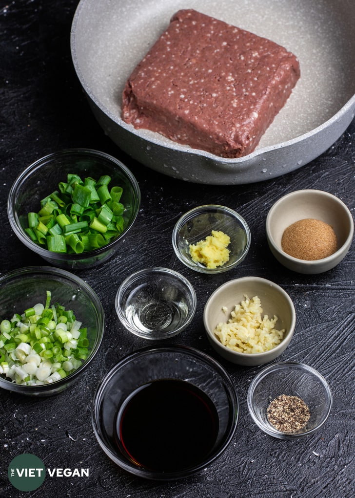 vegan bulgogi ingredients in separate bowls on a dark surface