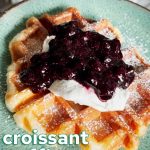 Vegan croissant waffle topped with coconut whip and blueberry chia jam