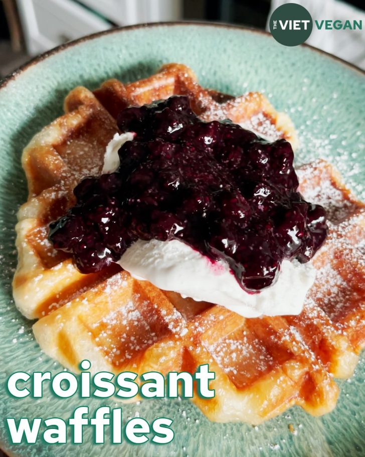 Vegan croissant waffle topped with coconut whip and blueberry chia jam