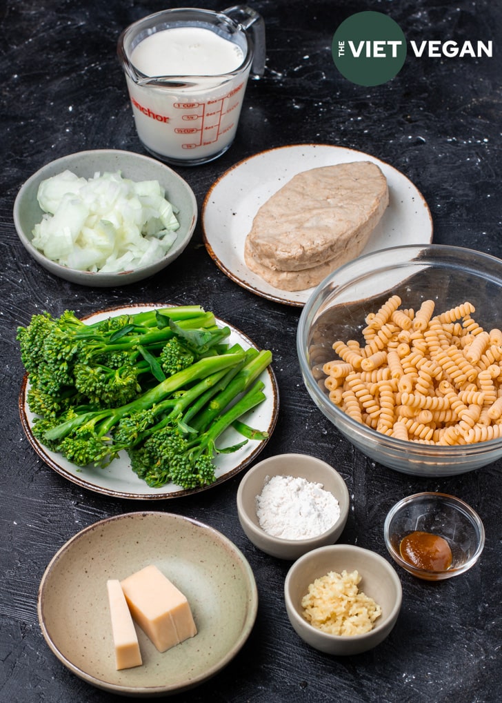 vegan alfredo ingredients mise en place on a dark background