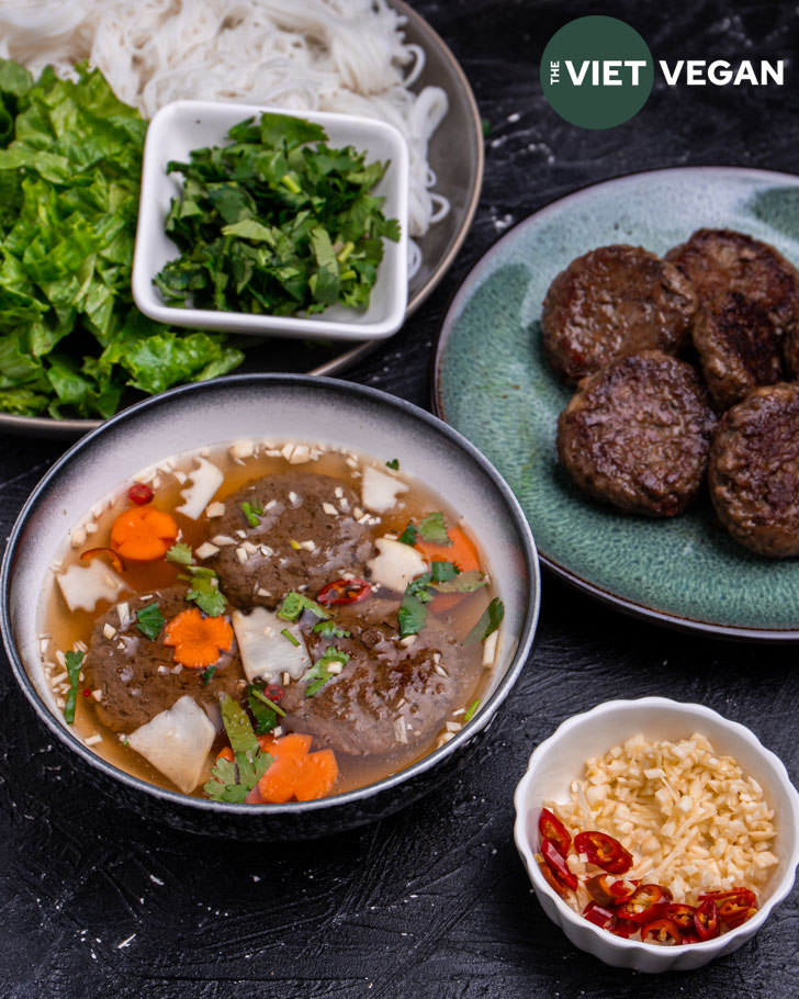 prepared ingredients for bun cha assembled and surrounding the individual serving bowl