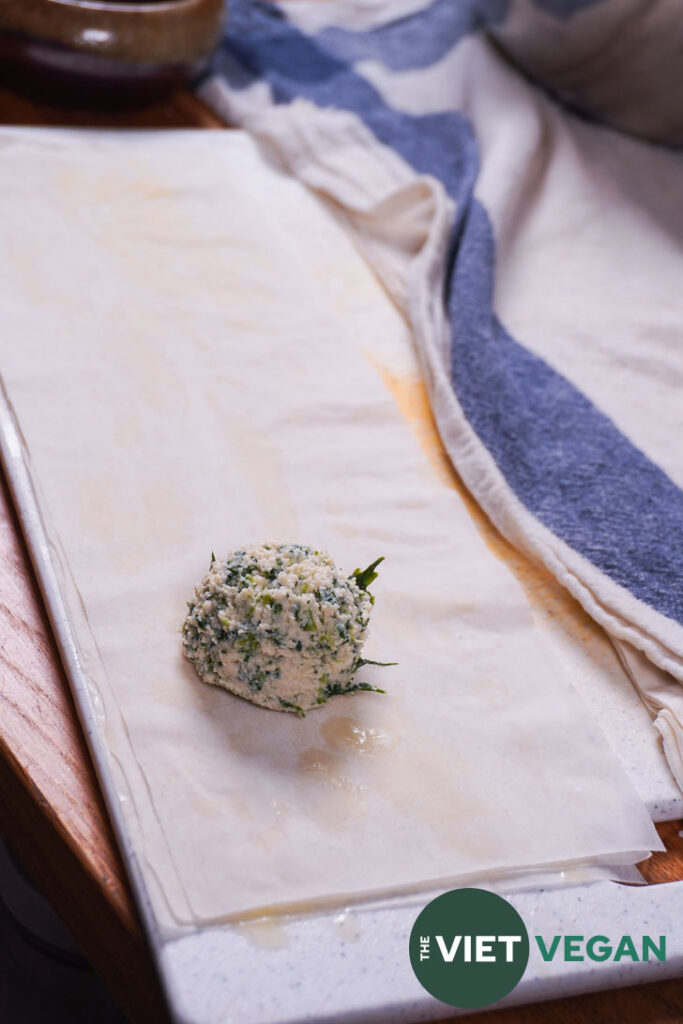 spanakopita filling on prepared strips of phyllo dough