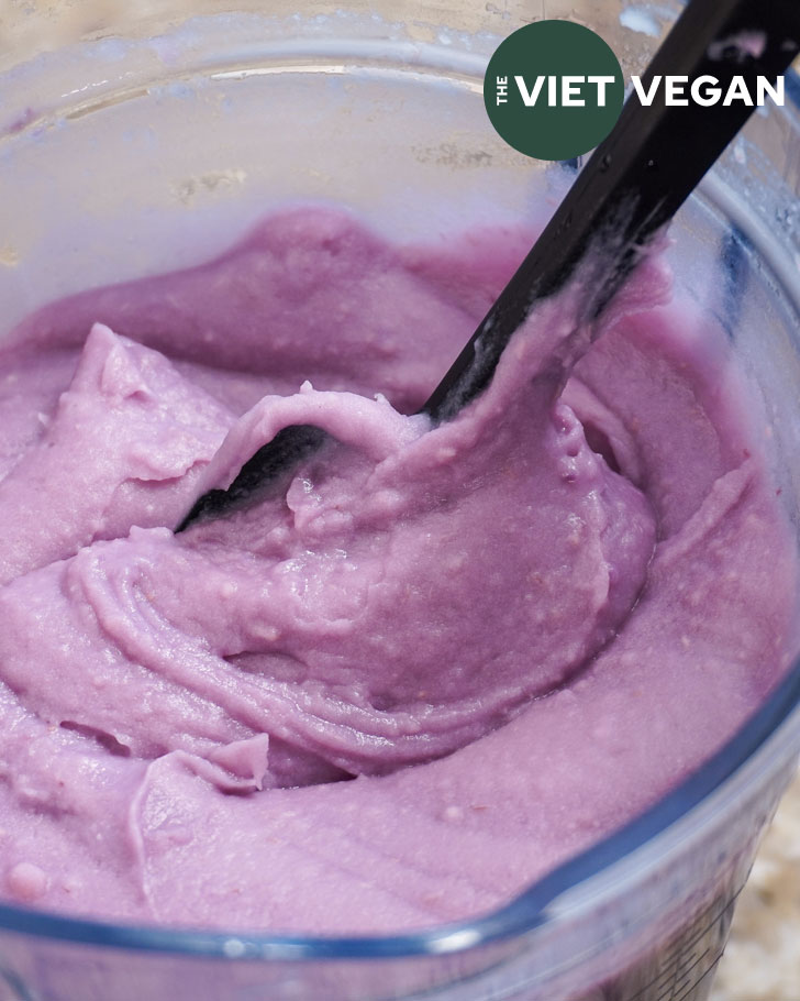 taro paste in a blender, with a black spatula