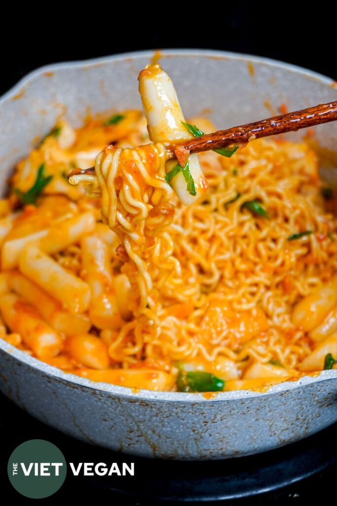 tteokkbokki and ramyun in a creamy carbonara gochujan sauce